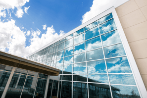 a brand new modern hospital building with a glass front 