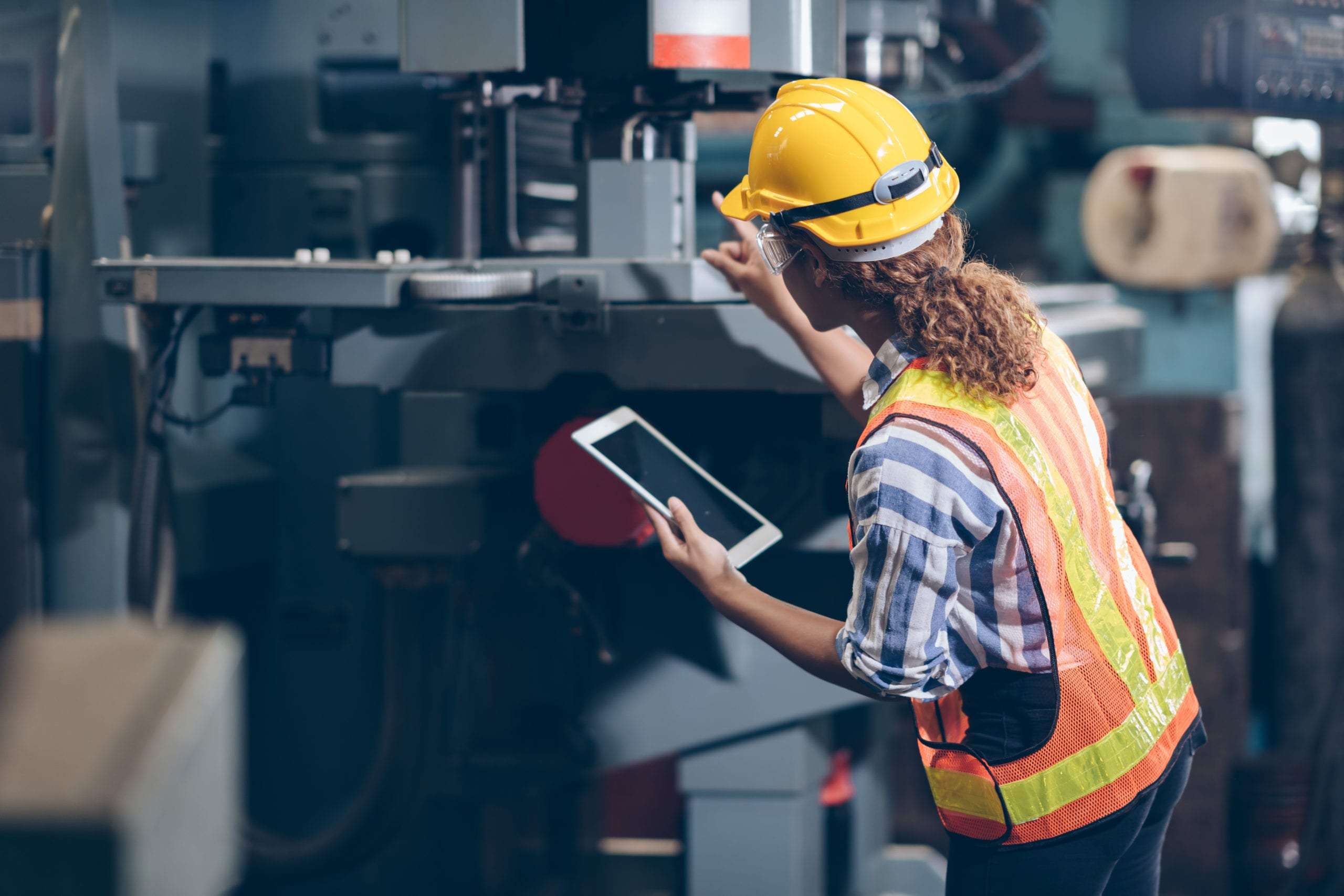 Facilities worker maintaining asset