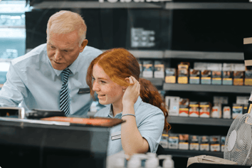 manager-teaches-supermarket-employee-new-system