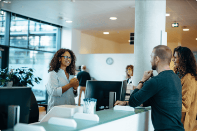 people-recieving-directions-from-office-receptionist