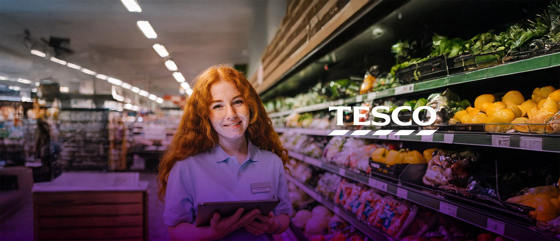 tesco employee holding tablet 2