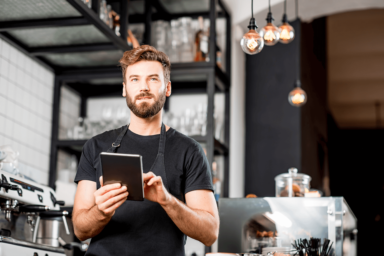 a barista using a tablet