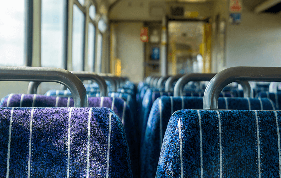 a close up shot of a row of seats in a passenger carriage