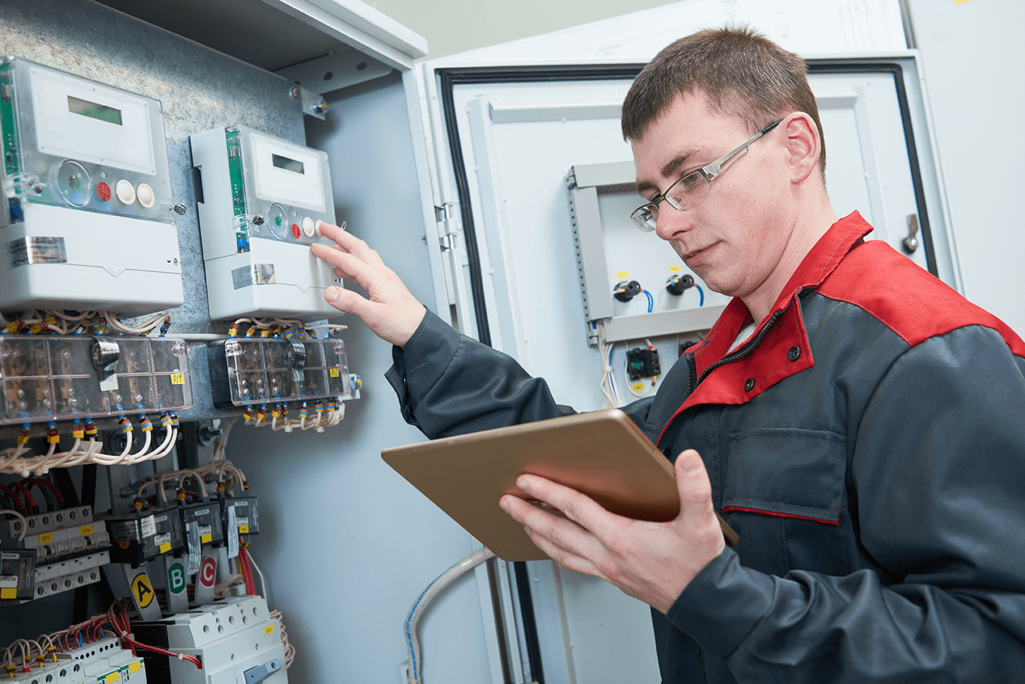 a maintenance worker checking an electrical box a maintenance worker checking an electrical box