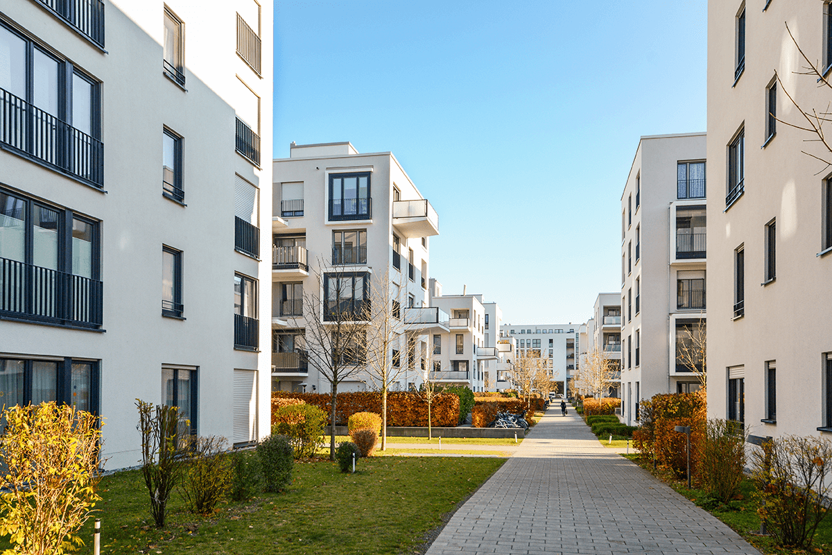 a shot of a several white student accomodation buildings