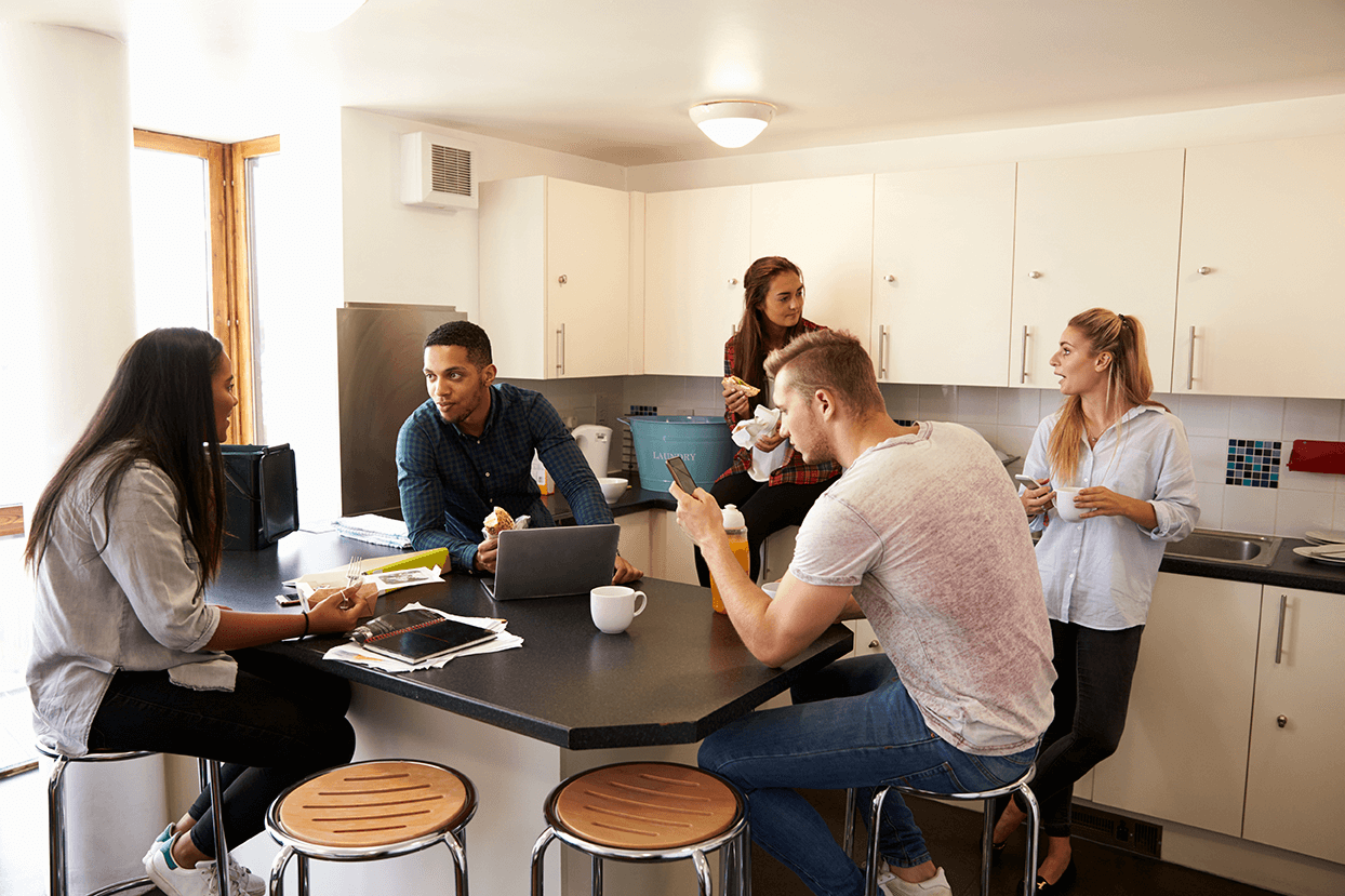 students having lunch in their communal kitchen